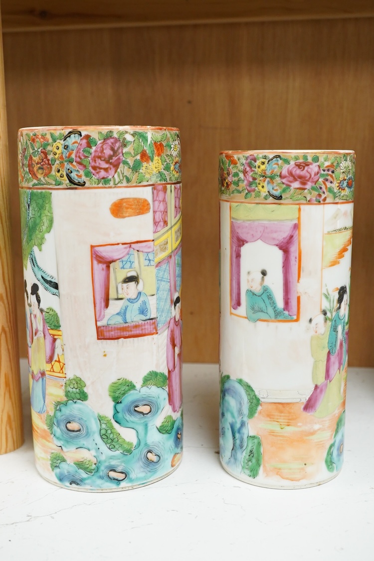 Two 19th century Chinese famille rose cylindrical vases and a similar bottle vase, 21cm